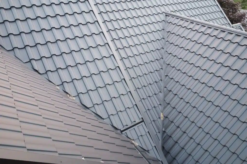 Close-up of a metal tile roof, highlighting the precision of overlapping tiles and neatly finished seams.