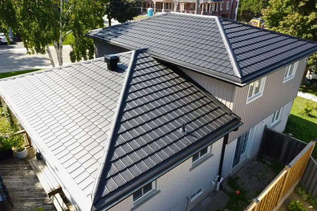 Frigge metal roof on a residential home with elegant tile design.