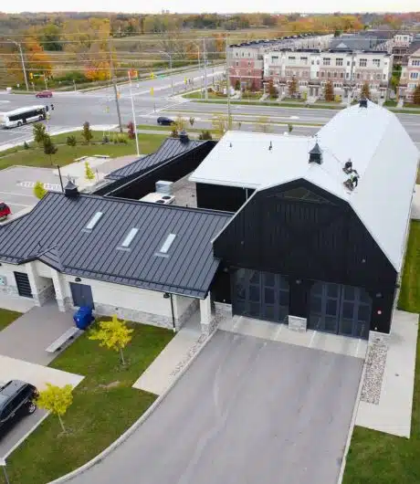 Modern commercial property with stylish black and white metal roofing.