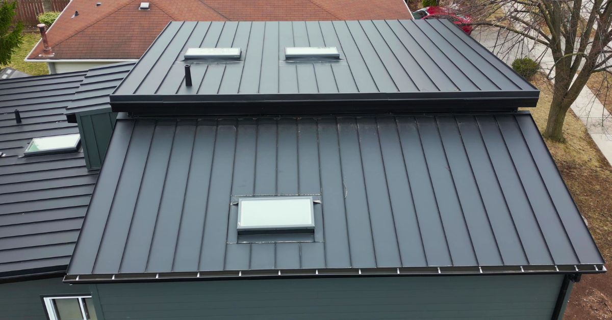 Standing seam metal roof with skylights on an Ontario home