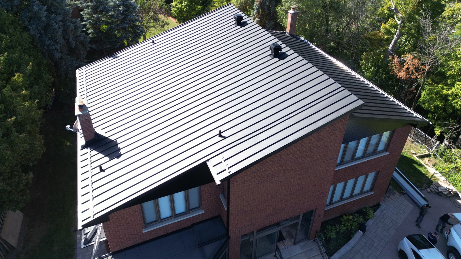 Split-level standing seam metal roof on a residential home