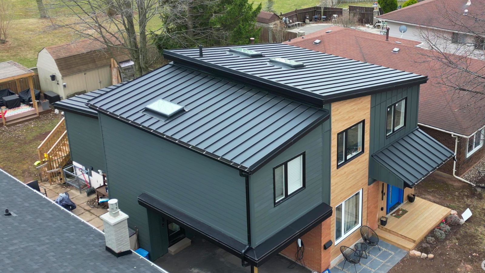 Standing Seam Roof with VELUX Skylights in Oakville Standing seam metal roof with VELUX skylights on a modern residential home in Oakville