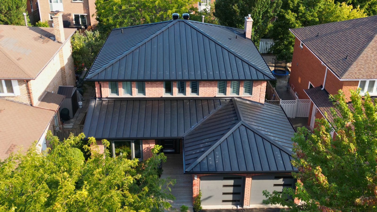 Textured Black Matt standing seam metal roof on a brick home in Glen Abbey, Oakville