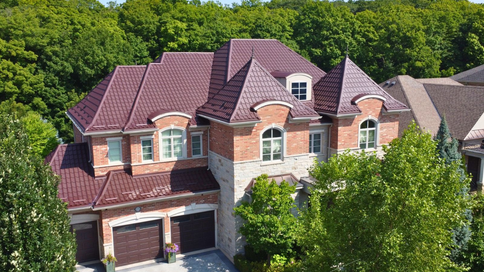 Metal Tile Roof on Grandvista Crescent RR887 Brown Ruukki Monterrey metal tile roof on a residential home on Grandvista Crescent