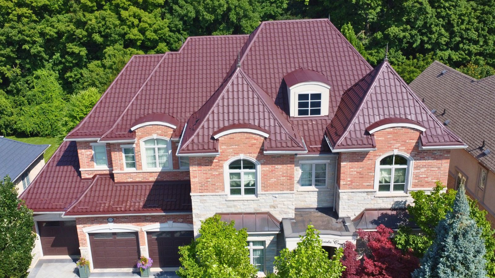 Front view of a Ruukki Monterrey metal tile roof in RR887 Brown on Grandvista Crescent