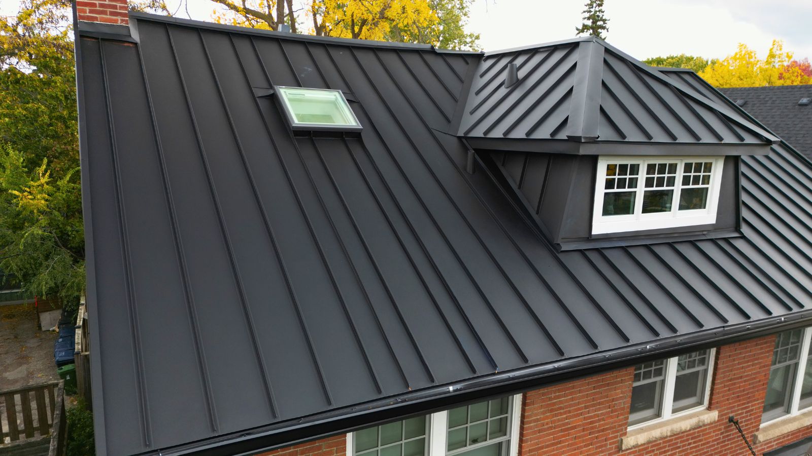 SSAB standing seam metal roof in High Park with a new VELUX skylight and metal-clad front dormer