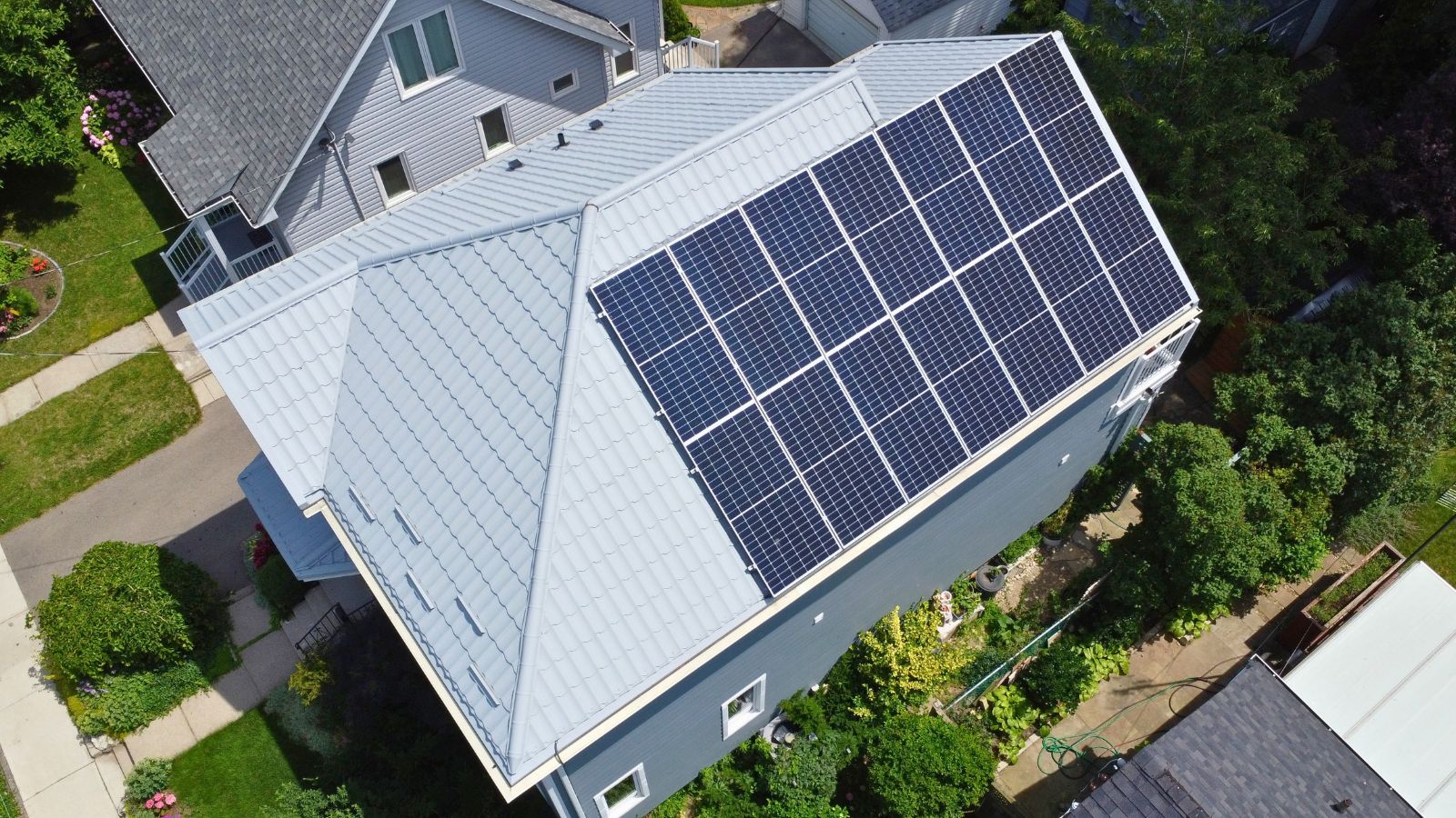 Aerial view of a Ruukki Monterrey metal tile roof with solar panels on an Etobicoke home